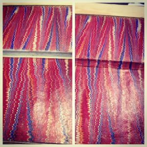 This small book had detached covers which were repaired using Japanese paper. We then roughly painted the pattern in to deceive the eye.